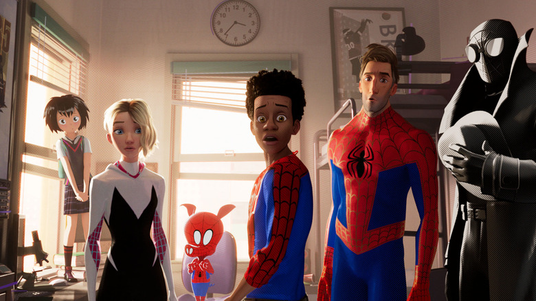 The Spider-People look forward in shock in Spider-Man: Into the Spider-Verse.