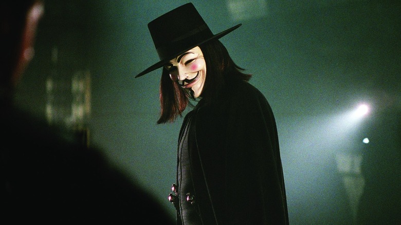 V tilts his head in V for Vendetta.