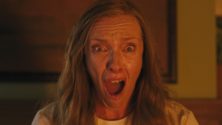 Toni Collette as Annie, watching her husband burn in Hereditary