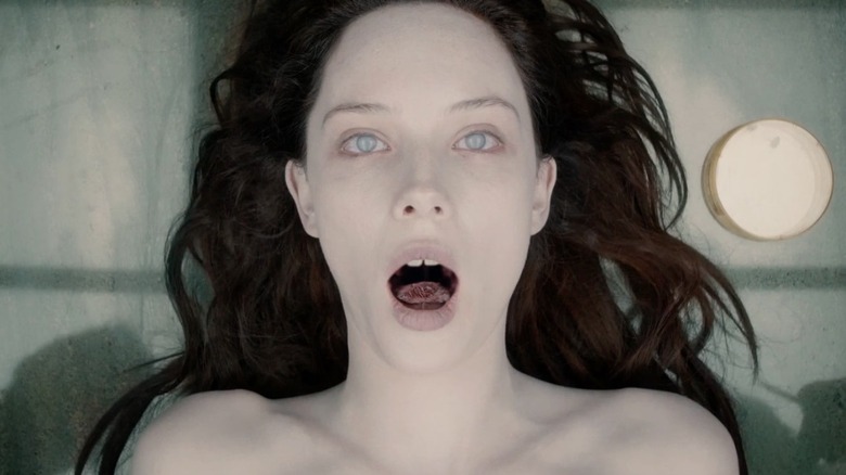 Olwen Kelly as Jane Doe, dead on a table in The Autopsy of Jane Doe