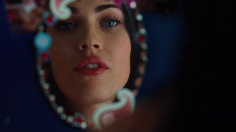 Jennifer looking in mirror