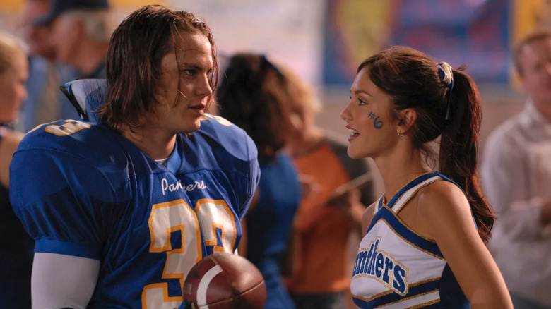 Tim Riggins (Taylor Kitsch) talks to Lyla (Minka Kelly  on the football field in Friday Night Lights (the TV series)