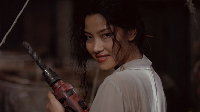 Napakpapha Nakprasitte as Panor, about to drill somebody in Art of the Devil II