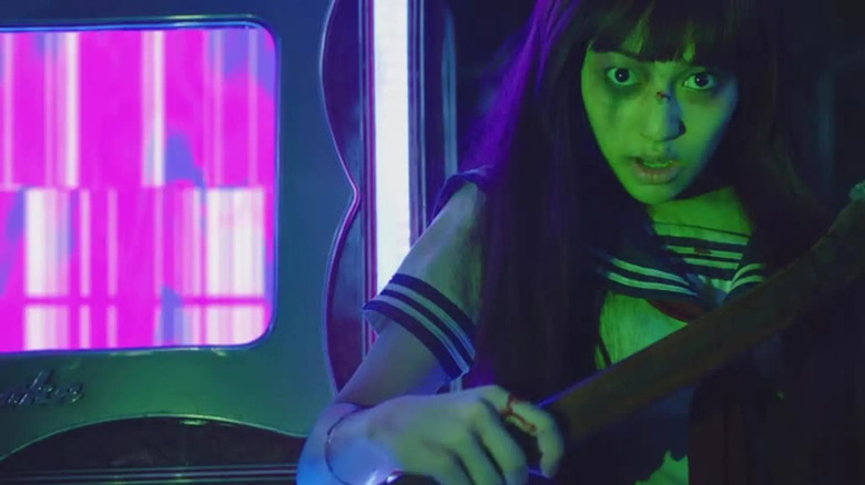 Gena Desouza as Premika, scaring people in Killer Karaoke