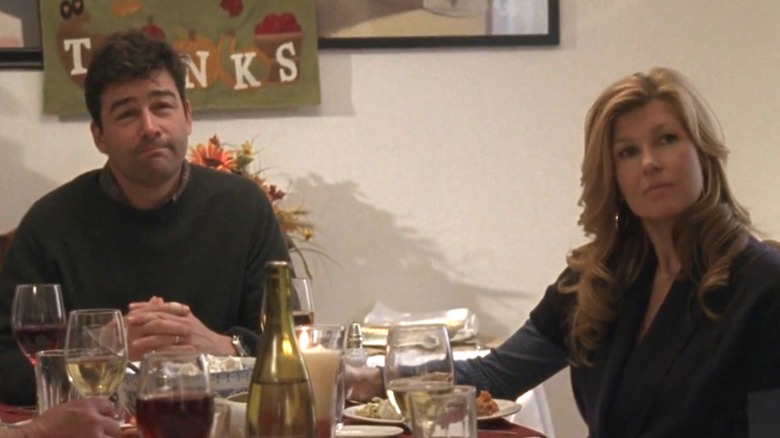 Kyle Chandler and Connie Britton as Eric and Tami Taylor sitting at the Thanksgiving table on Friday Night Lights