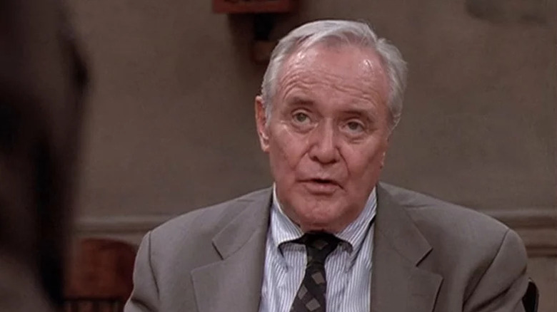 A sweaty Davis (Jack Lemmon) looks up while speaking in 12 Angry Men (1997)