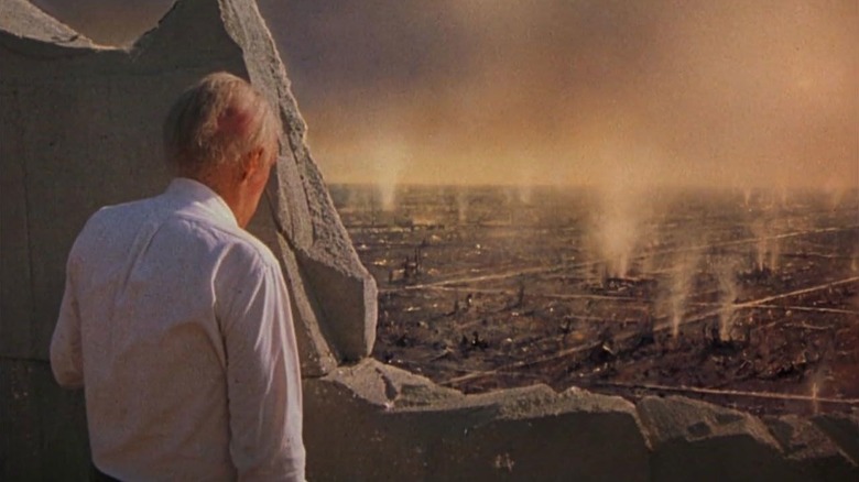Russell Oakes (Jason Robards) surveys a devastated and smoking city in The Day After