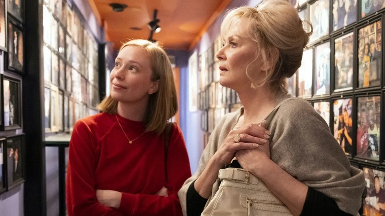 Hannah Einbinder as Ava and Jean Smart as Deborah standing in the hallway of a comedy club in Hacks