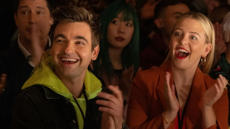 Drew Tarver and Helene Yorke as Cary and Brooke smiling and clapping in The Other Two