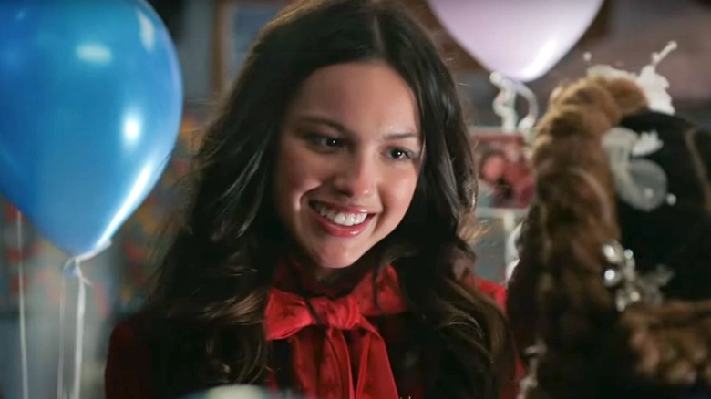 Olivia Rodrigo as Nini smiling in High School Musical The Musical The Series