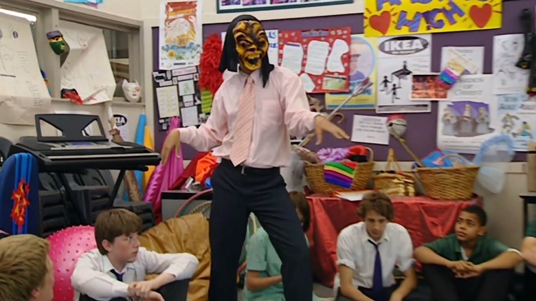 Chris Lilley as Mr. G wearing a mask and dancing for students in Summer Heights High