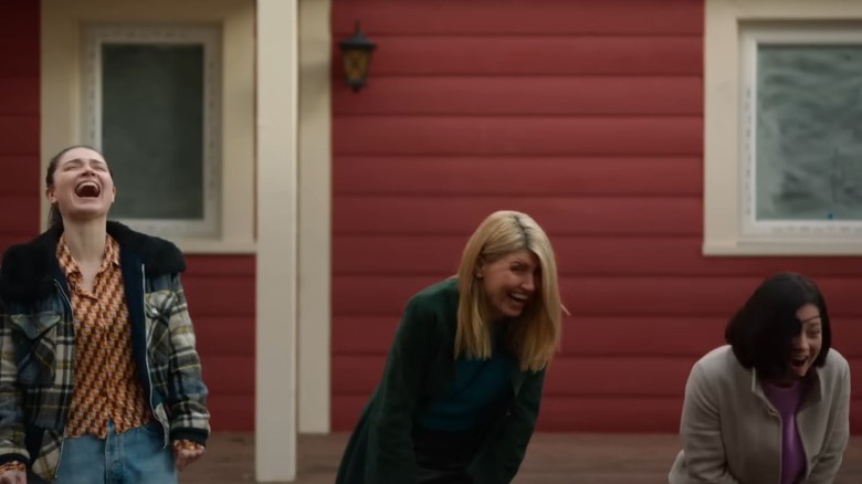 Eve Hewson as Becka Garvey, Sharon Horgan as Eva Garvey, and Sarah Green as Bibi Harvey laughing boisterously on Bad Sisters