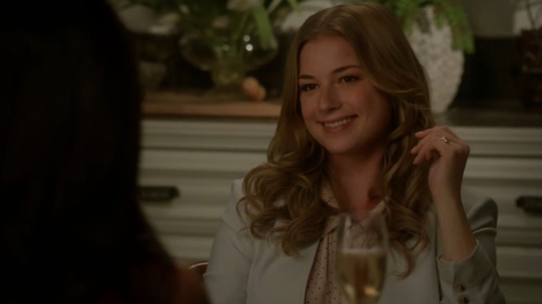Emily VanCamp as Emily Thorne smiling deviously on Revenge