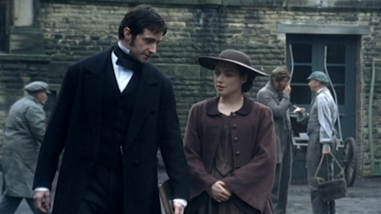 Mr. Thornton (Richard Armitage) and Margaret (Daniela Danby-Ashe) walking in Milton in North & South