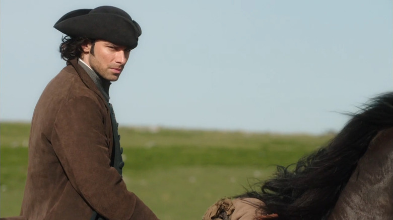 Poldark (Aidan Turner) glaring on horseback in Poldark