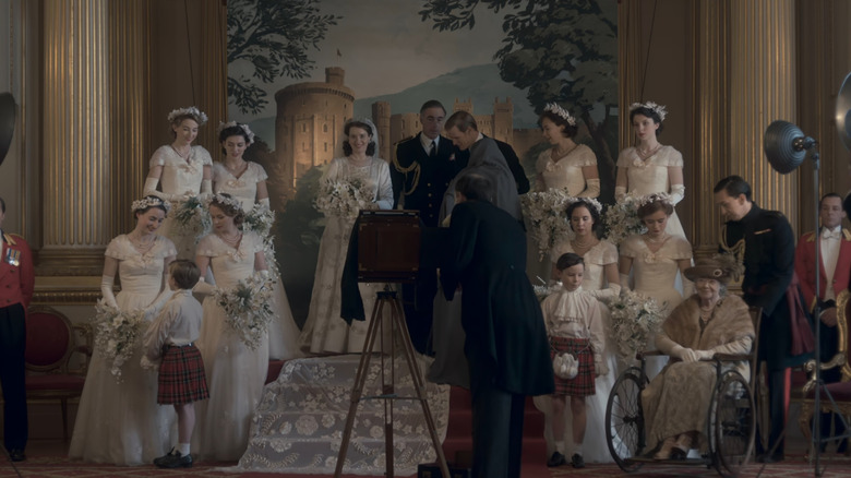 The royal family taking portrait at Elizabeth's (Claire Foy) wedding in The Crown
