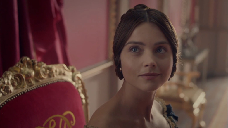 Victoria (Jenna Coleman) smiling up at Lord Melbourne in Victoria