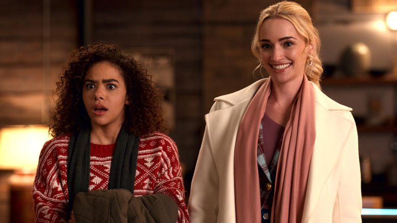 Antonia Gentry as Ginny stands next to Brianne Howey as Georgia on Ginny & Georgia