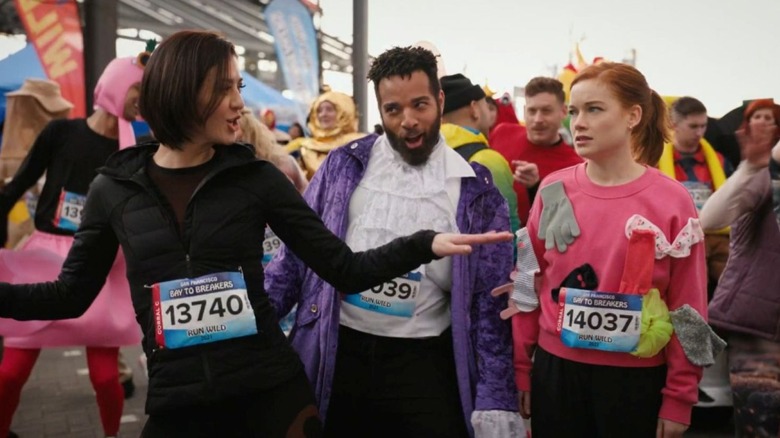 Katie Findlay as Rose Williams stands outside with John Clarence Stewart as Simon and Jane Levy as Zoey Clarke on Zoey's Extraordinary Playlist