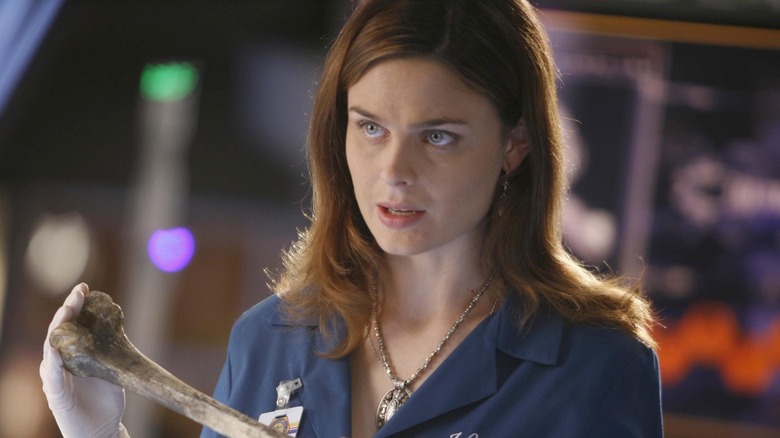 Emily Deschanel as Temperance Brennan, holding a bone on Bones