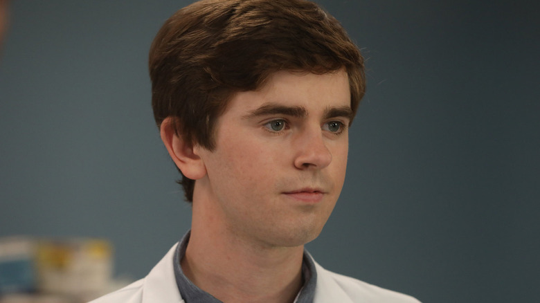 Freddie Highmore as Dr. Shaun Murphy, standing in an office on The Good Doctor