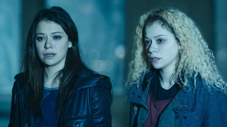 Tatiana Maslany as both dark-haired Sarah Manning (left) and blonde, curly-haired Helena (right) in Orphan Black