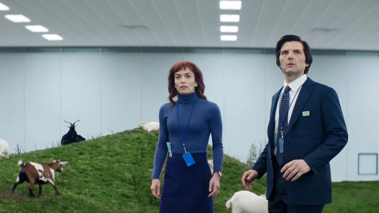 Britt Lower and Adam Scott, as Mark and Helly, observe goats on the Severance floor