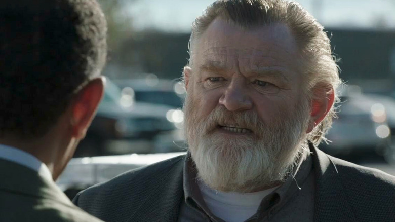 A bewildered Bill Hodges (Brendan Gleeson) talks intensely to another man in Mr. Mercedes