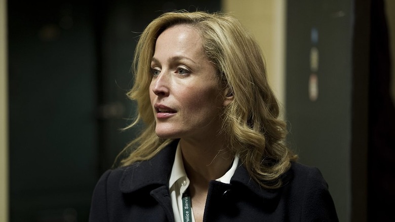 Stella Gibson (Gillian Anderson) stands in an office in The Fall