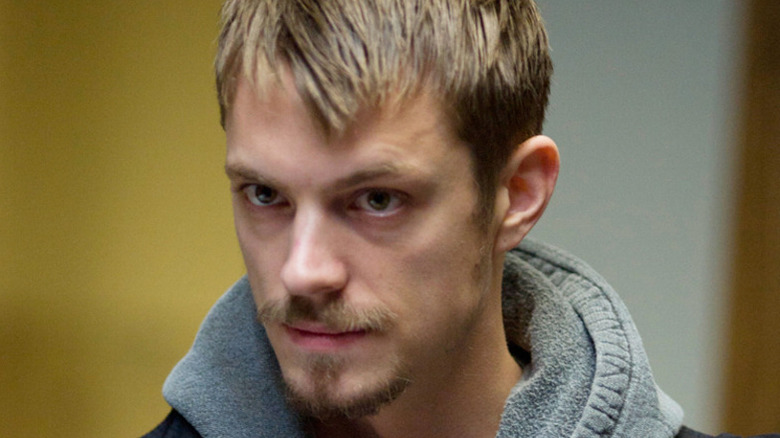 Stephen Holder (Joel Kinnaman) stands warily in The Killing
