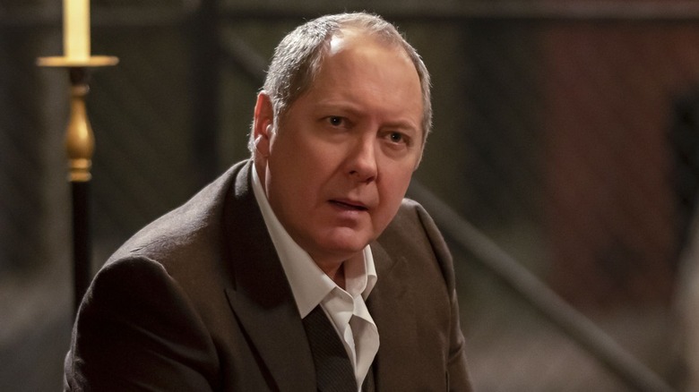 Raymond Reddington (James Spader) looks up with a serious expression in The Blacklist