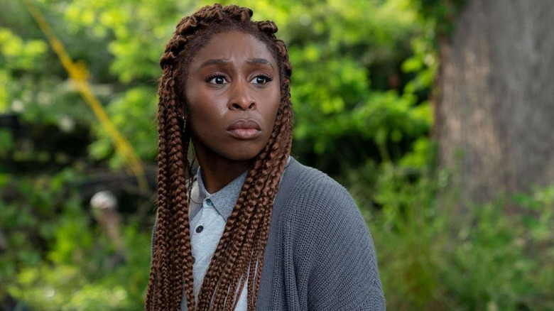 Holly Gibney (Cynthia Erivo) looks intently outside in The Outsider