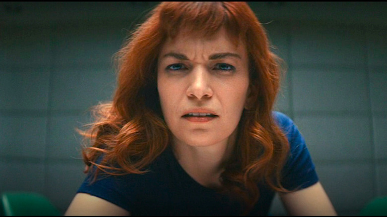 Britt Lower as Helly with disheveled hair looking into the camera in Severance