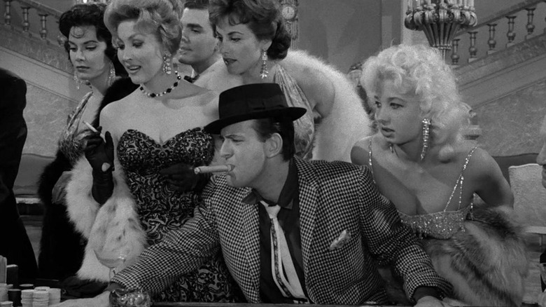 Larry Blyden as Rocky gambling while surrounded by showgirls in The Twilight Zone