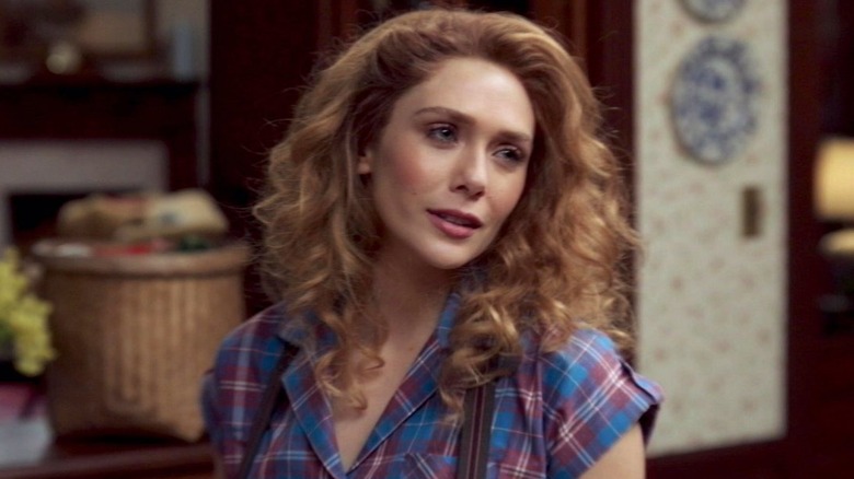 Elizabeth Olsen as Wanda Maximoff with an 80s hairdo in WandaVision