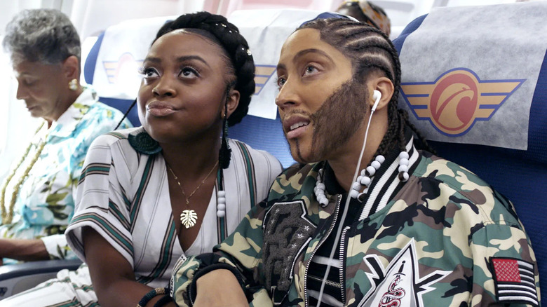 Quinta Brunson and Robin Thede as a couple on an airplane in A Black Lady Sketch Show