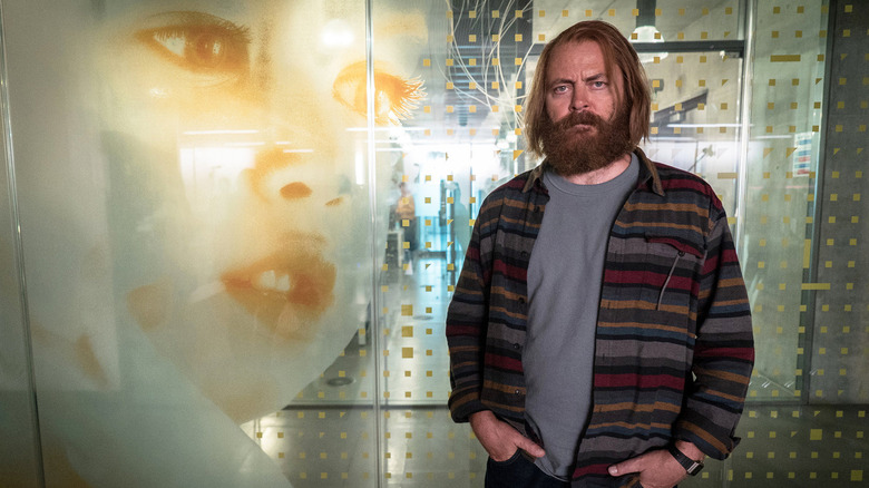 Forest (Nick Offerman) next to an image of a baby on Devs