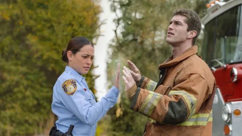 Linda Esquivel (Natalie Martinez) and Eric Denton (Josh Carter) on opposite sides of the dome in Under the Dome