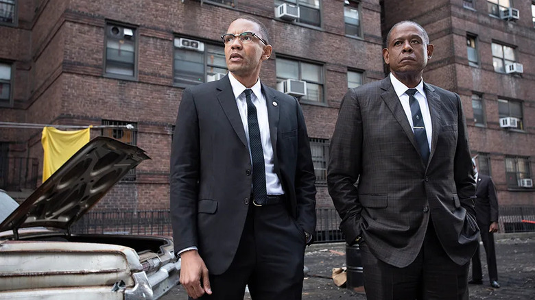 Malcom X (Nigél Thatch) and Bumpy Johnson (Forest Whitaker) walk through the streets of Harlem in Godfather of Harlem