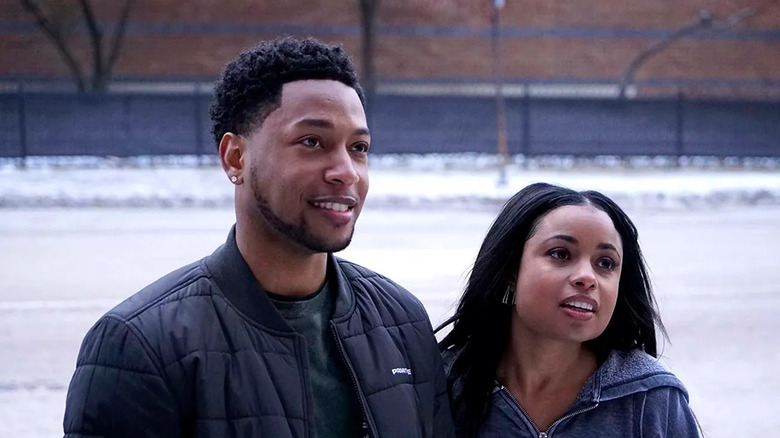 Emmett Washington (Jacob Latimore) and Tiffany (Hannaha Hall) stand together on a snow street in The Chi
