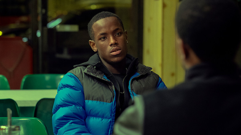 Jamie Tovell (Micheal Ward) sits in a restaurant in Top Boy