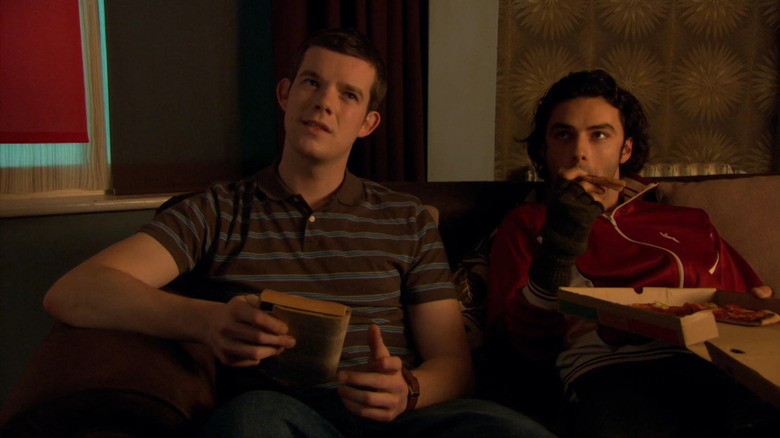 George (Russell Tovey) and Mitchell (Aidan Turner) sitting on couch in Being Human
