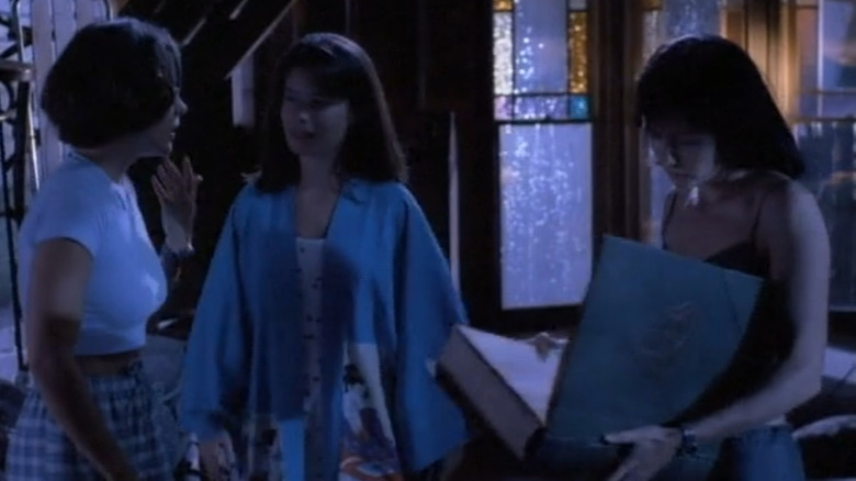 Phoebe (Alyssa Milano), Piper (Holly Lauren Combs) and Prue (Shannen Doherty) in attic on Charmed
