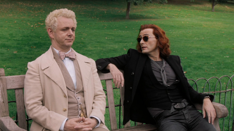 Aziraphale (Michael Sheen) and Crowley (David Tennant) sitting on bench in Good Omens