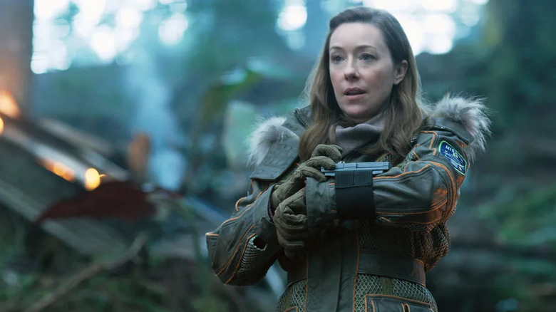 Maureen Robinson (Molly Parker) uses a wrist communicator in Lost in Space (2018)