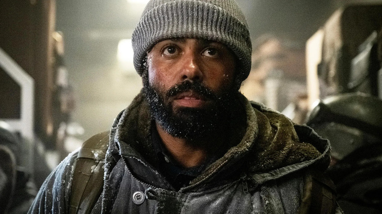 Andre Layton (Daveed Diggs) looks up with snow in his beard in Snowpiercer