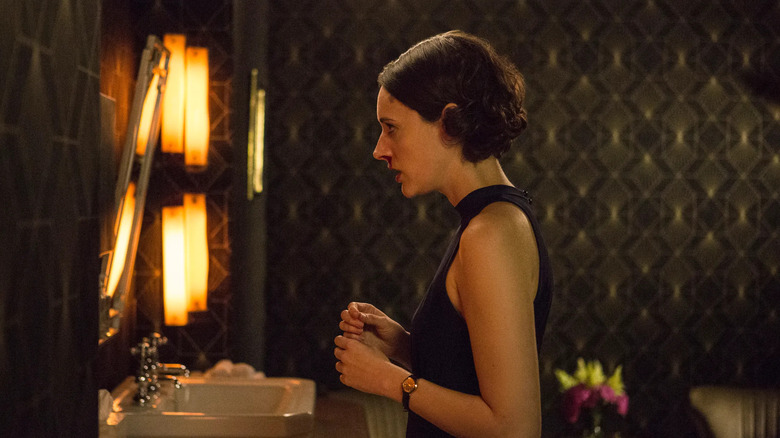 Phoebe Waller-Bridge as Fleabag, gazing in a bathroom mirror on Fleabag