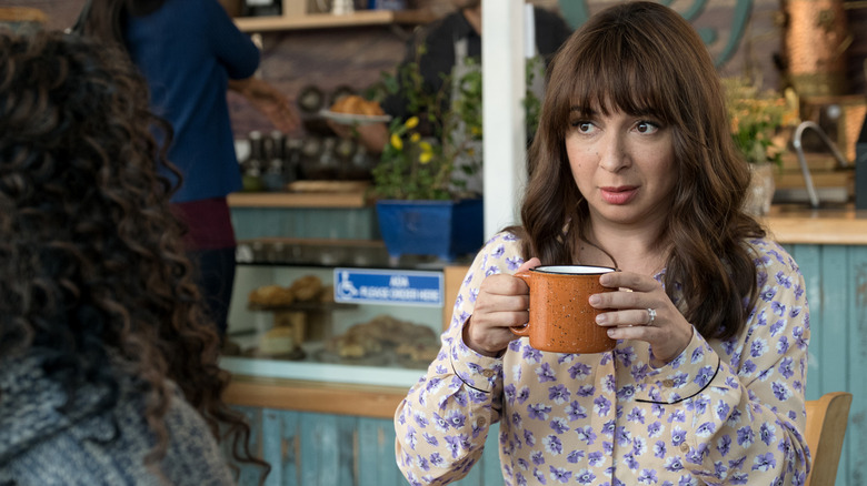 June Hoffman (Maya Rudolph) holding a coffee mug on Forever
