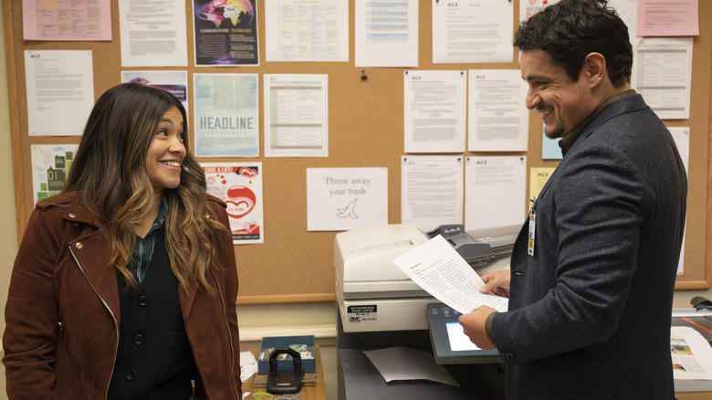 Nell (Gina Rodriguez) smiling at TJ (Jesse Garcia) on Not Dead Yet