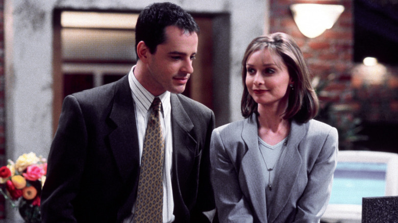 Gil Bellows and Calista Flockhart as Billy and Ally, walking through an office on Ally McBeal